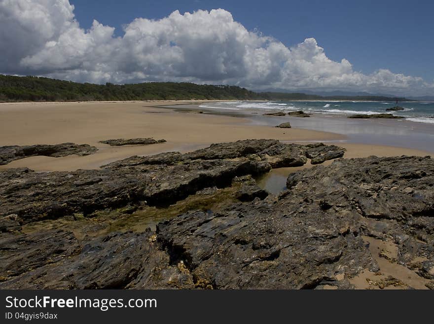 Image shows a view north of a quiet section of coastline on the north coast of NSW Australia. Image shows a view north of a quiet section of coastline on the north coast of NSW Australia