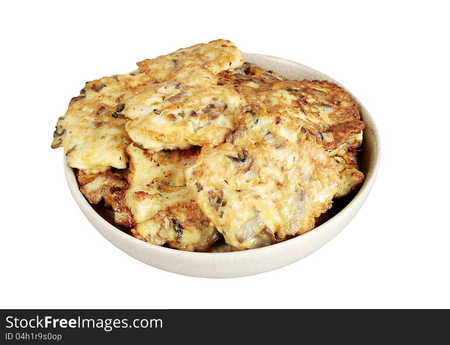 Cutlets from chicken,mushrooms and eggs in ceramic bowl isolated over white. Cutlets from chicken,mushrooms and eggs in ceramic bowl isolated over white