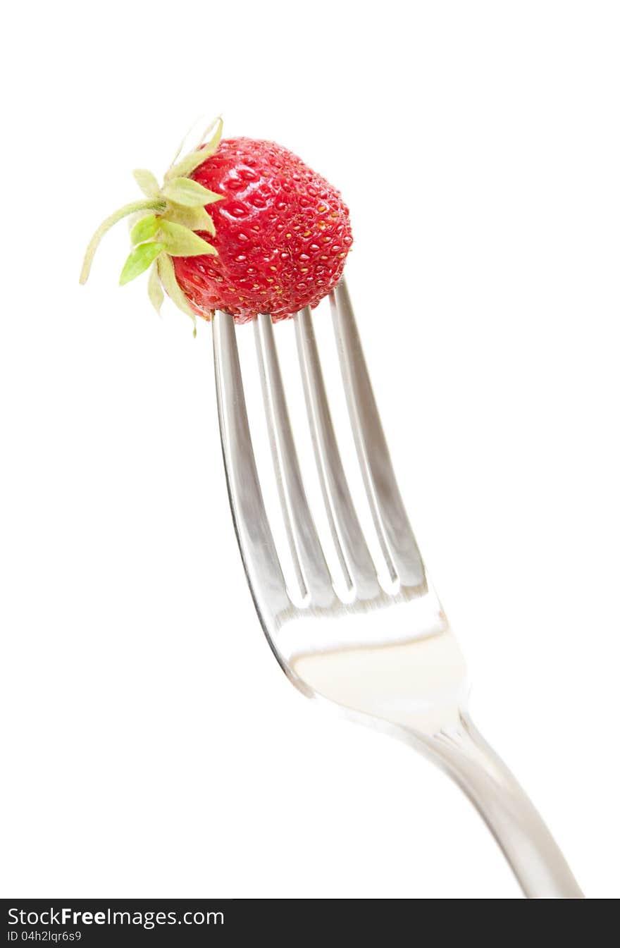 Fork with fresh Strawberry on a white background. Fork with fresh Strawberry on a white background