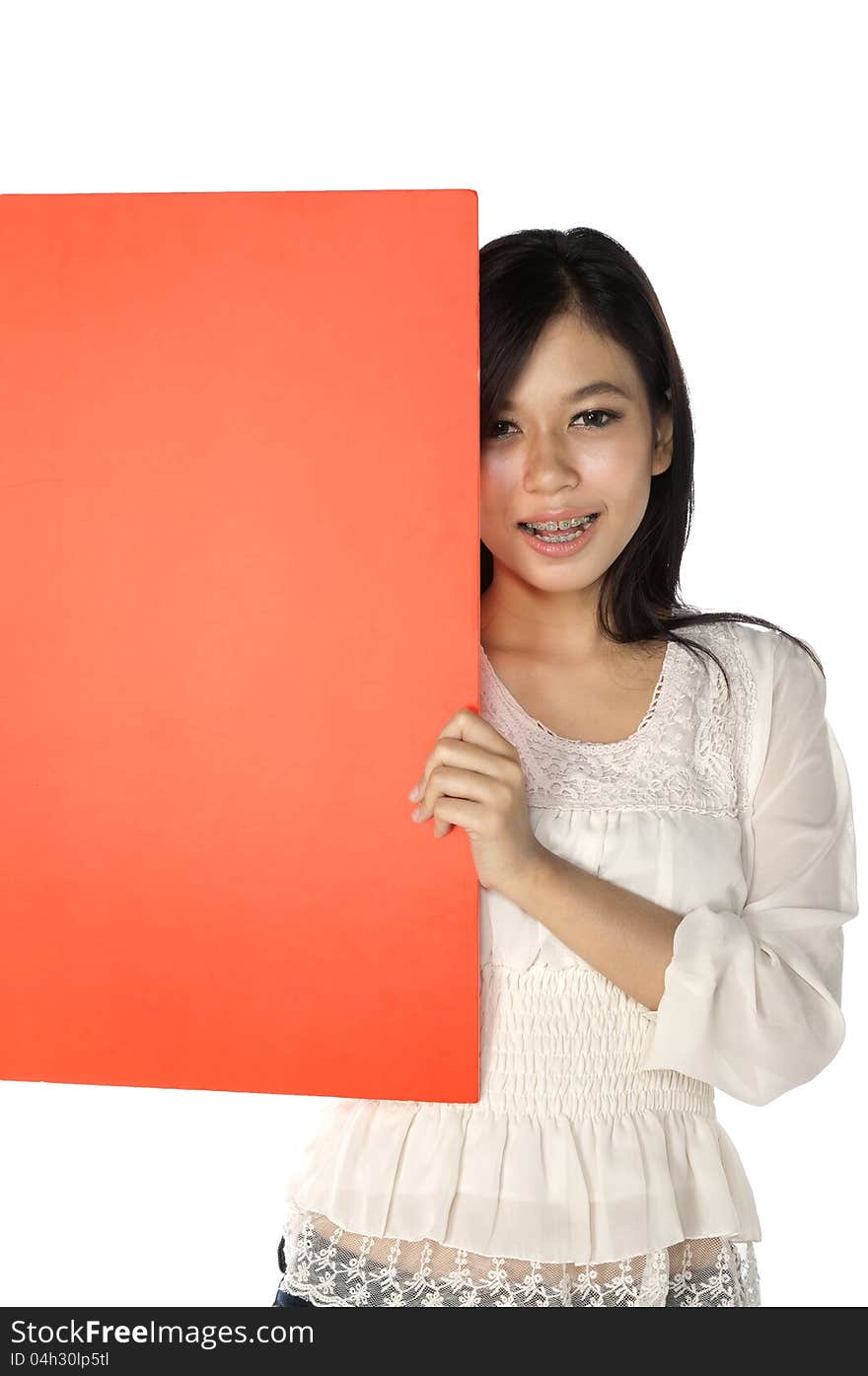 Beautiful woman hold blank red banner isolated over white background. You can put your message on the banner. Beautiful woman hold blank red banner isolated over white background. You can put your message on the banner