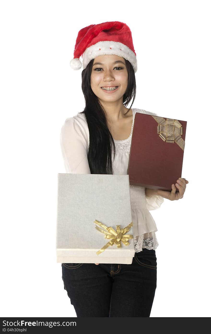 Woman wearing santa hat hold gift box isolated over white background. Woman wearing santa hat hold gift box isolated over white background