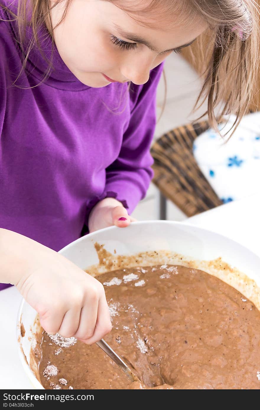 Little Girl Baking In The Kitchen