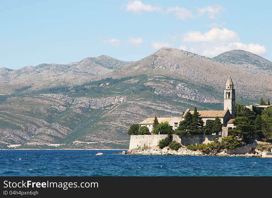 An ancient church on a background of mountains. An ancient church on a background of mountains