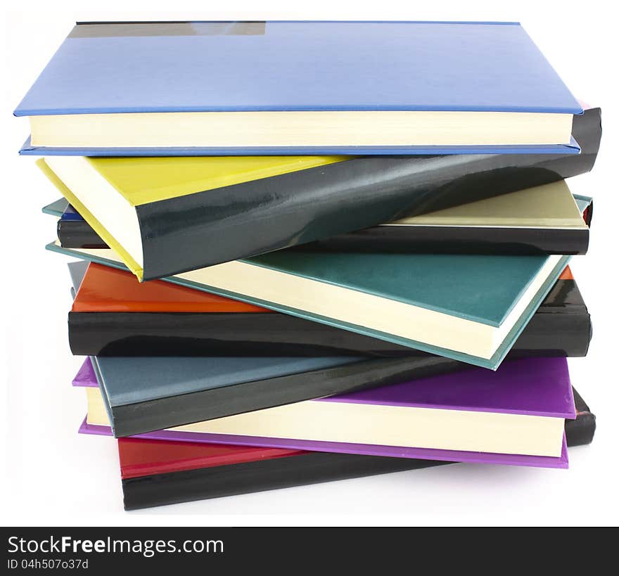 Pile of color hardcover books over white background. Pile of color hardcover books over white background