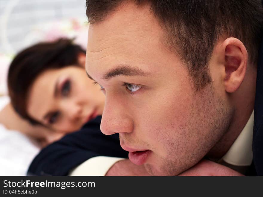 Bride And Groom Lying In Bedroom Close Up