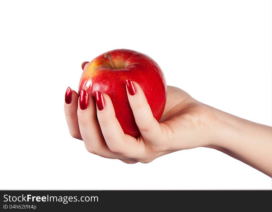 Fresh red apple in hand on a white background