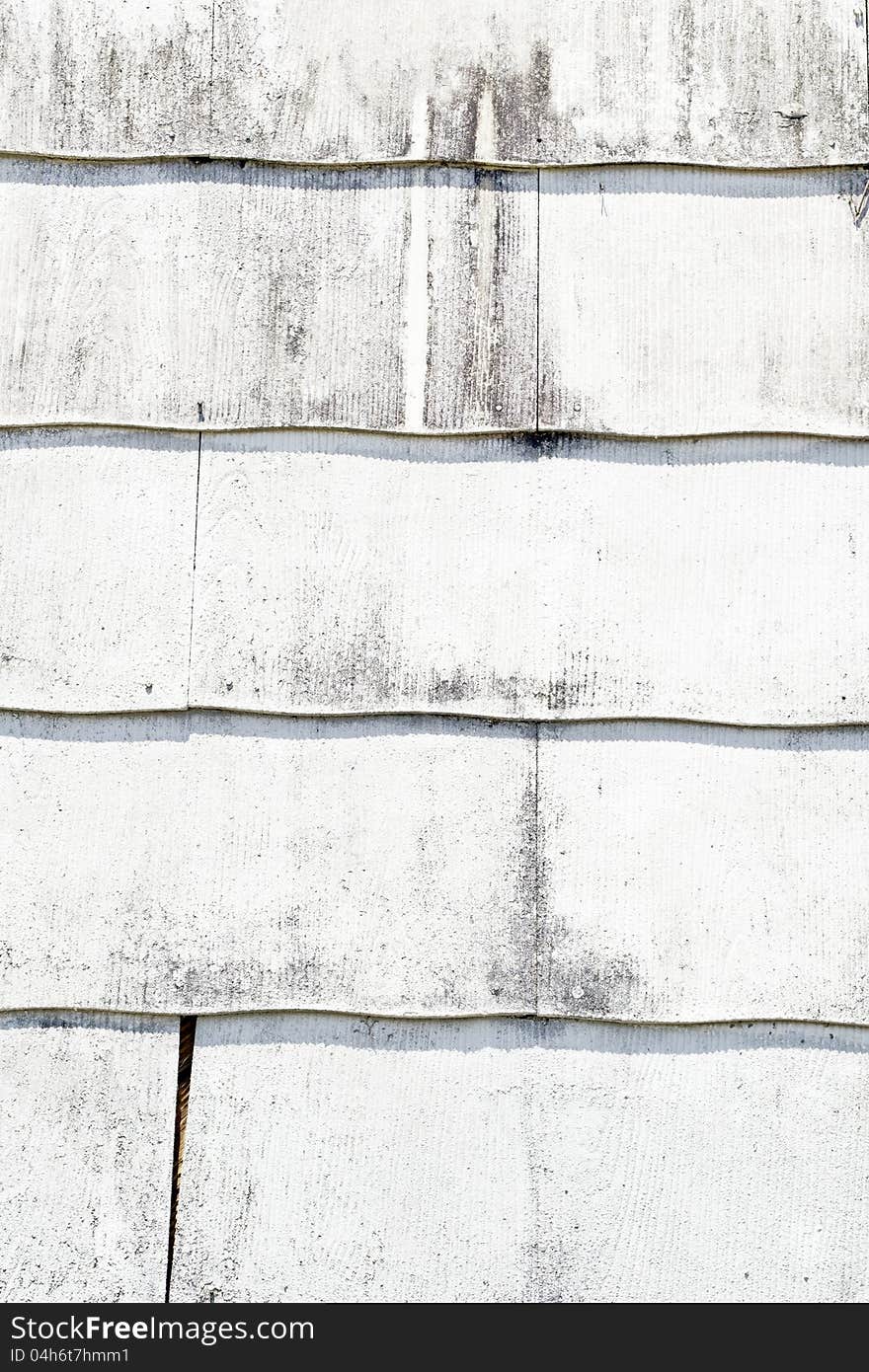 Large siding on a wall painted white. Large siding on a wall painted white.