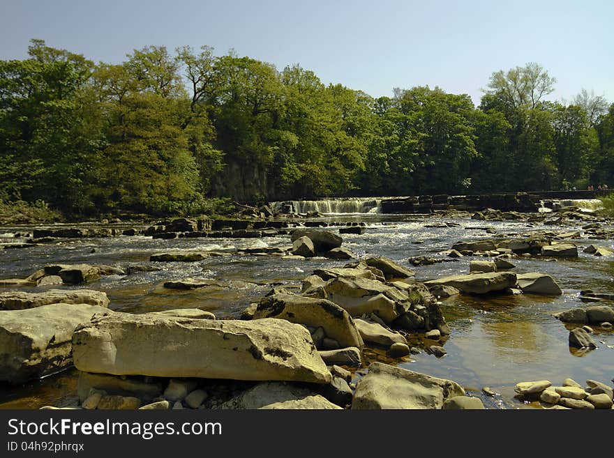 A view of Richmond waterfall on the river Swale from near the rocks