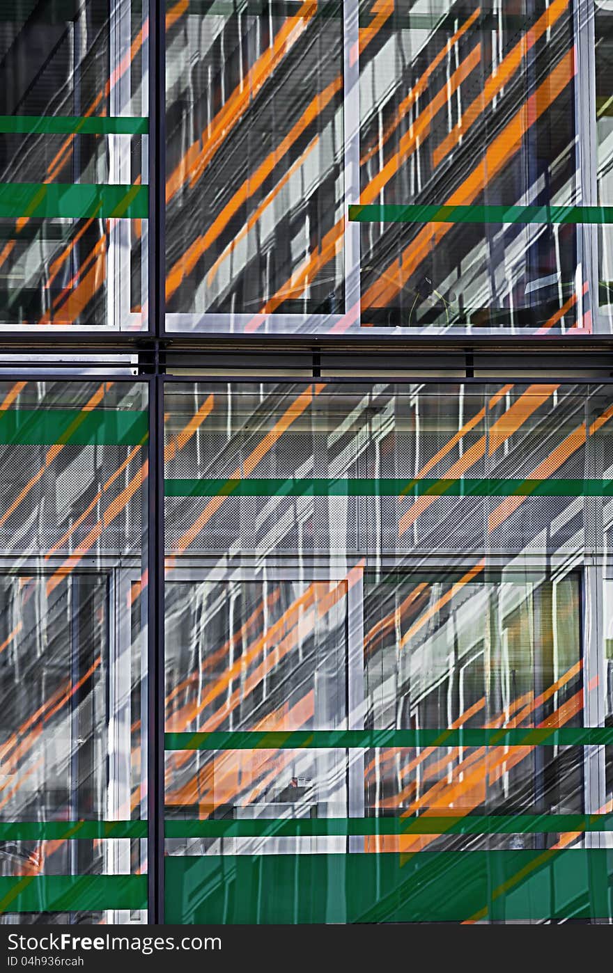 Mirroring in the glass facade of a building