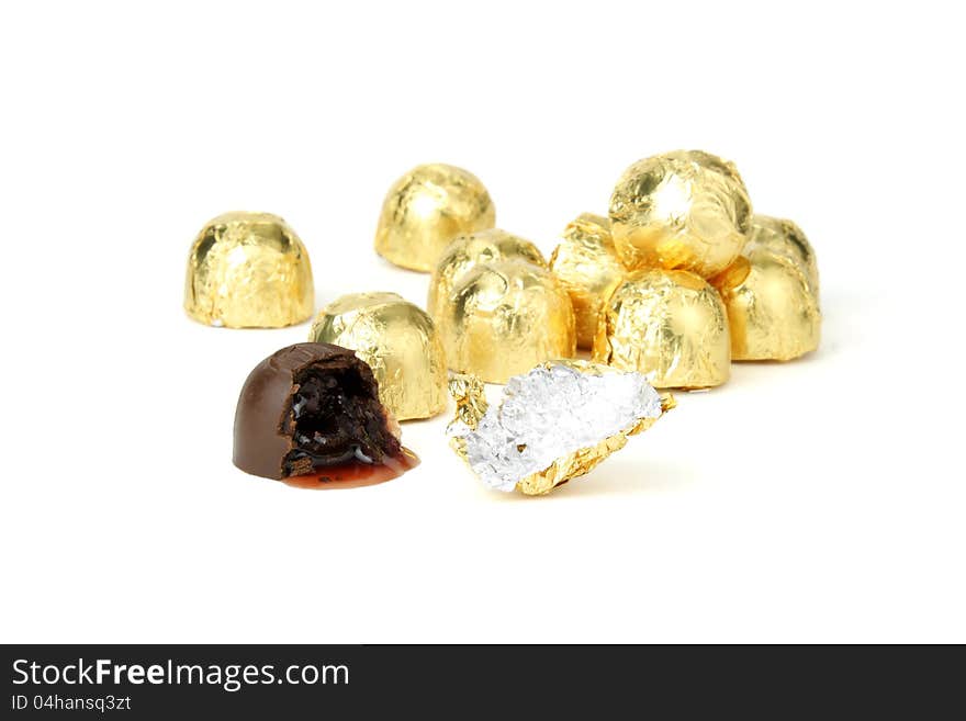 Chocolate cherry candy in golden wrappers