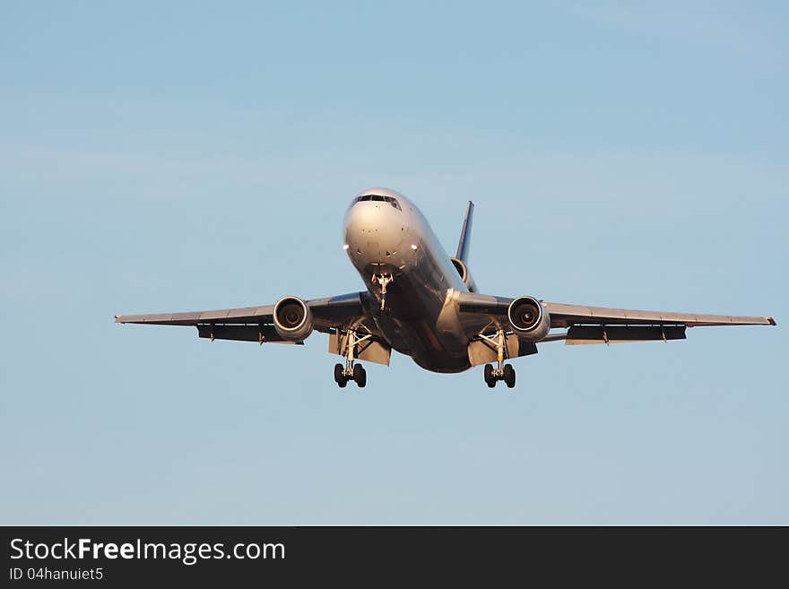 Front view of a large cargo aircraft landing. Front view of a large cargo aircraft landing