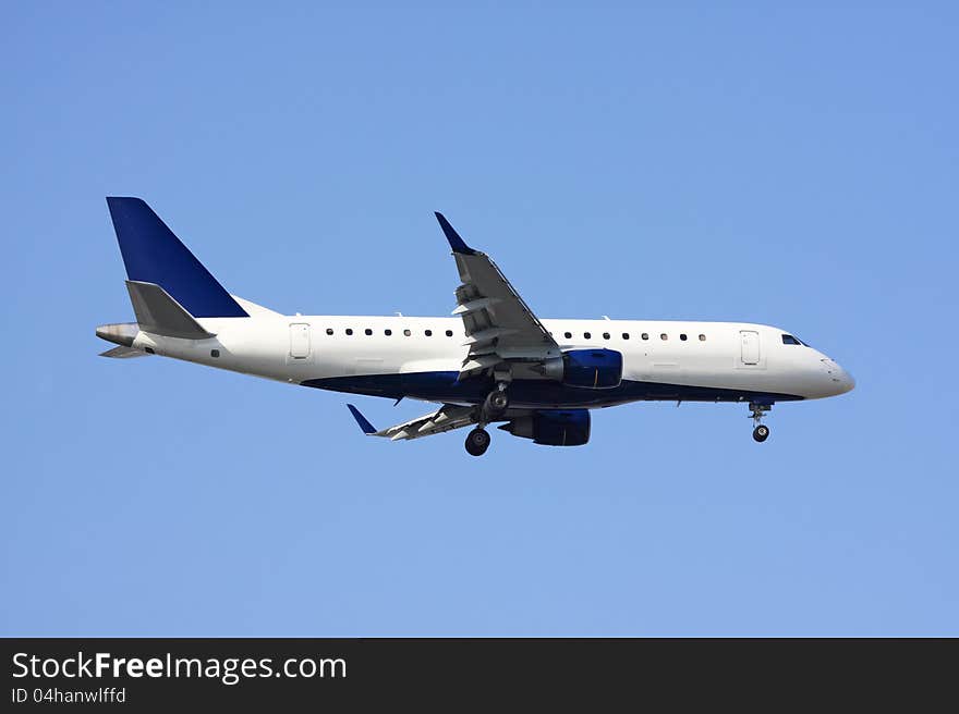 Side view of an airliner against blue sky