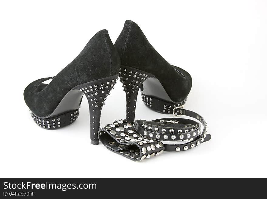 Pair of women's black high heel shoes and accessories. Pair of women's black high heel shoes and accessories