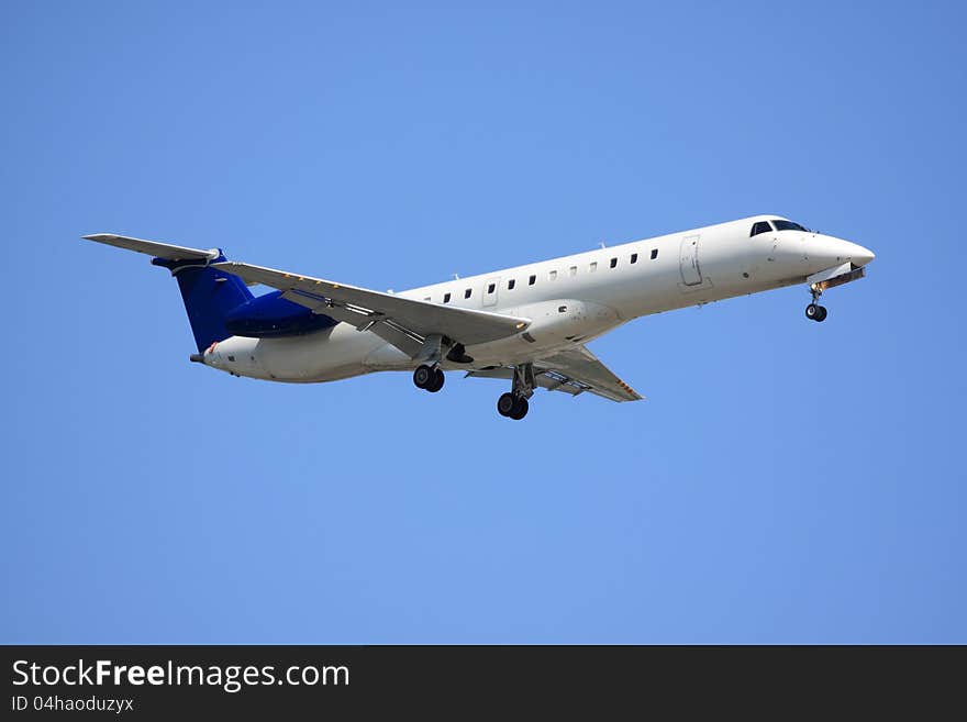 Small passenger jet in flight