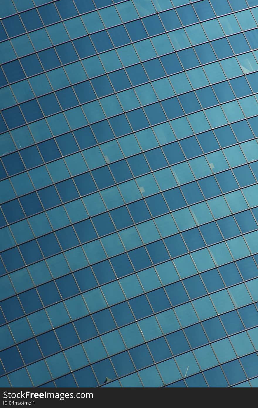 Glass wall of an office building- rows of windows