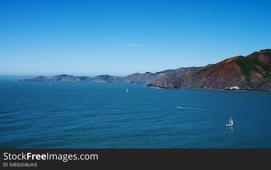 Top view on pacific ocean coastline of California, close to San-Francisco bay, with yachts and boats. Top view on pacific ocean coastline of California, close to San-Francisco bay, with yachts and boats