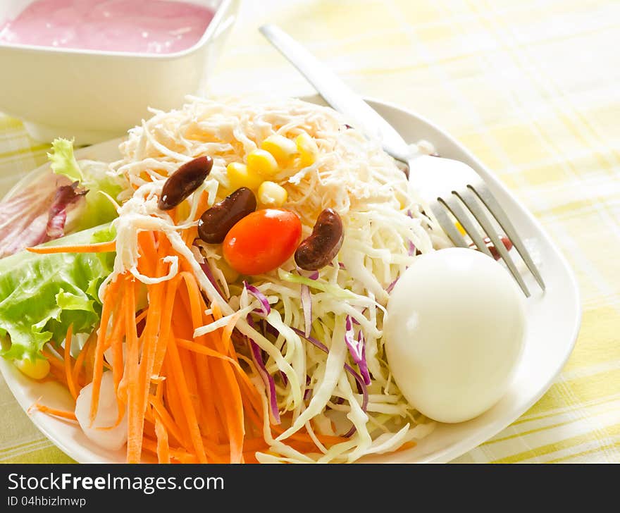 Fresh salad with egg,carrot,red beans and cherry tomatoes