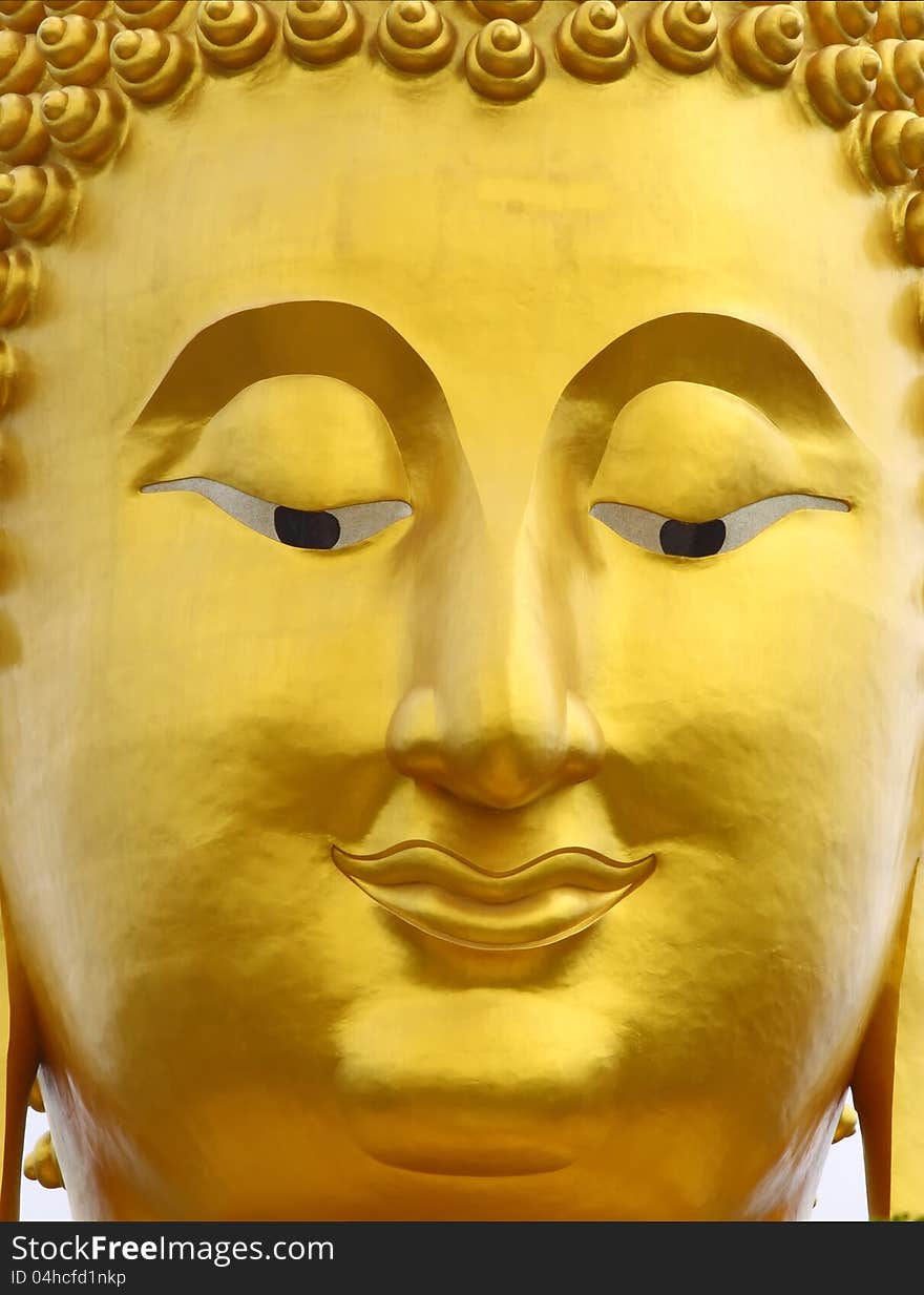 Close up shot of the smile Buddha's face. Close up shot of the smile Buddha's face