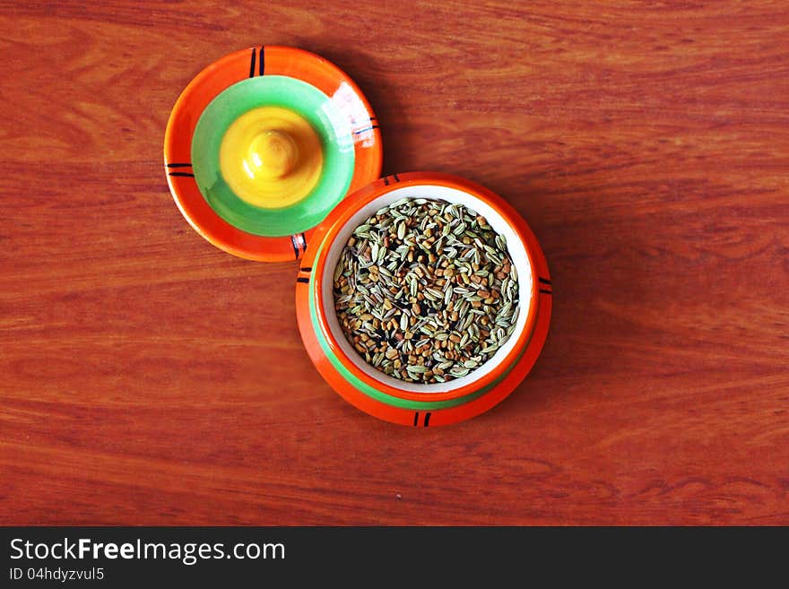 Indian masala in masala pot on wooden background. Indian masala in masala pot on wooden background