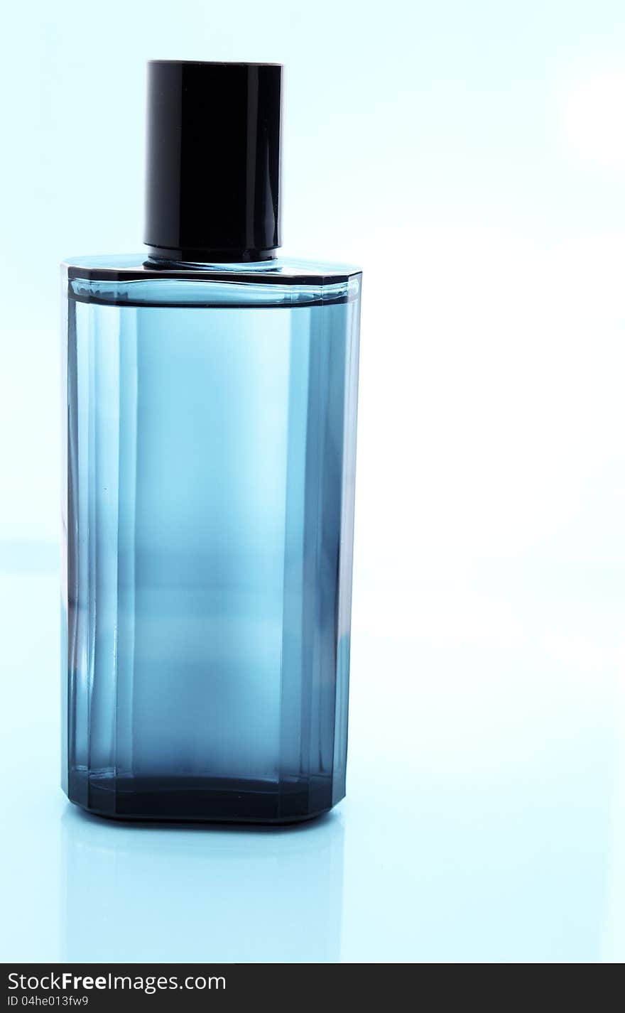 Blue perfume bottle with reflection