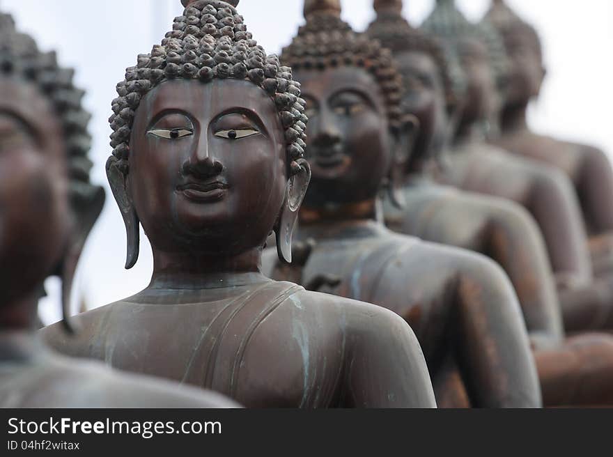 Statues of Buddha in a row