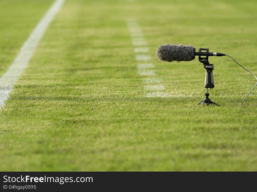 Directional microphone boom with windshield at a football stadium