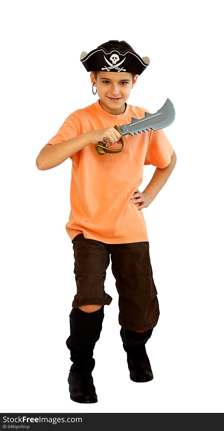 A boy dressed as a pirate with hat and boots and yataghan toy in his hand isolated on a white background