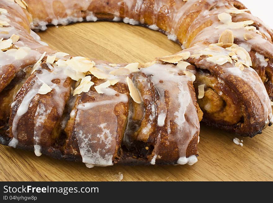 Roll cake of caramel with almond and sugar glass