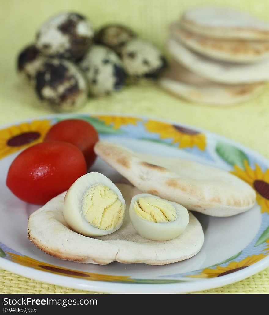 Boiled quail eggs and cherry tomatoes