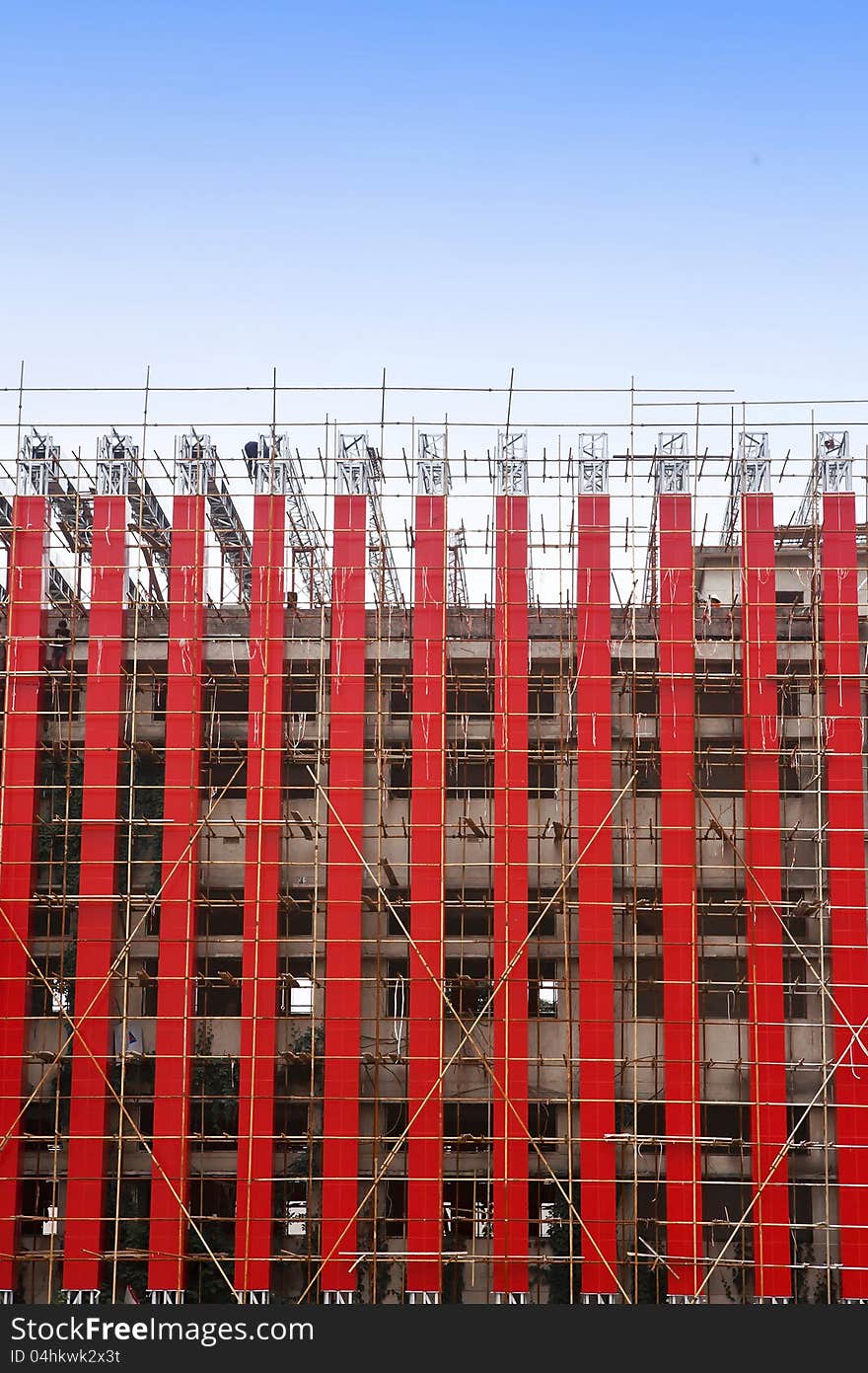 A unfinished building with scaffolding. A unfinished building with scaffolding