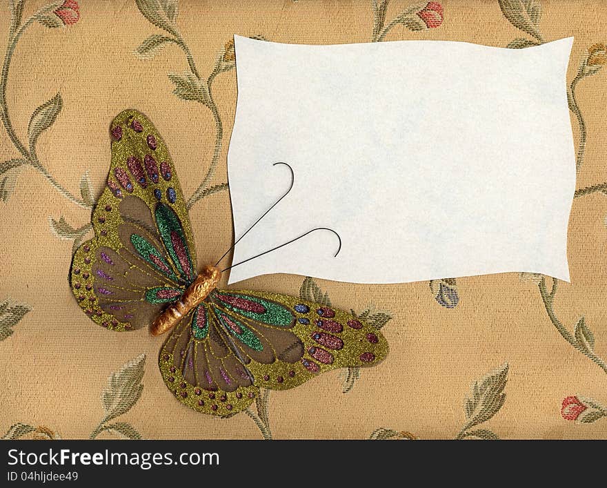 Beautiful butterfly made in fabric on texture background. Beautiful butterfly made in fabric on texture background