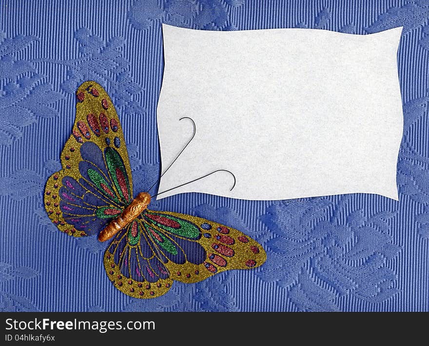 Beautiful butterfly made in fabric on texture background. Beautiful butterfly made in fabric on texture background