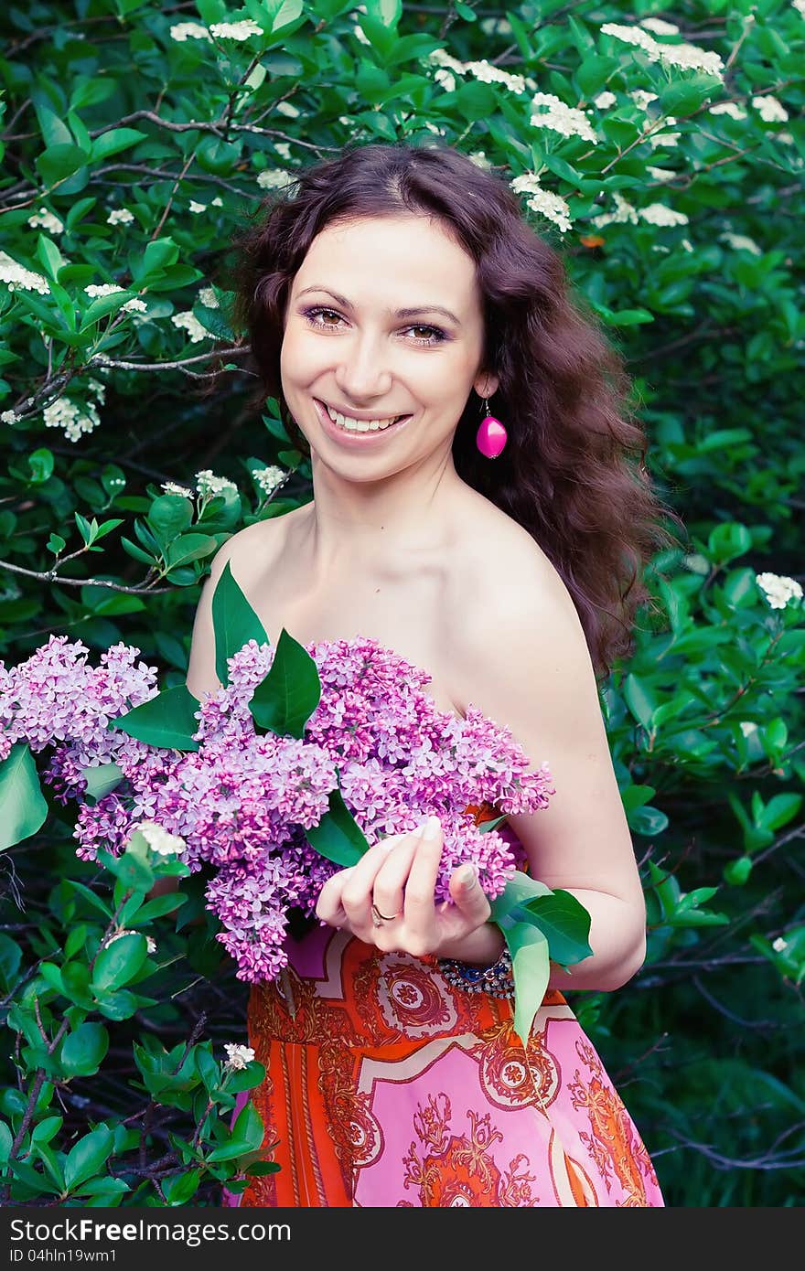 Woman With Lilac Flowers