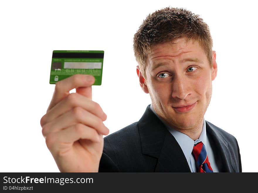 Young Businessman holding a credit card isolated on a white background