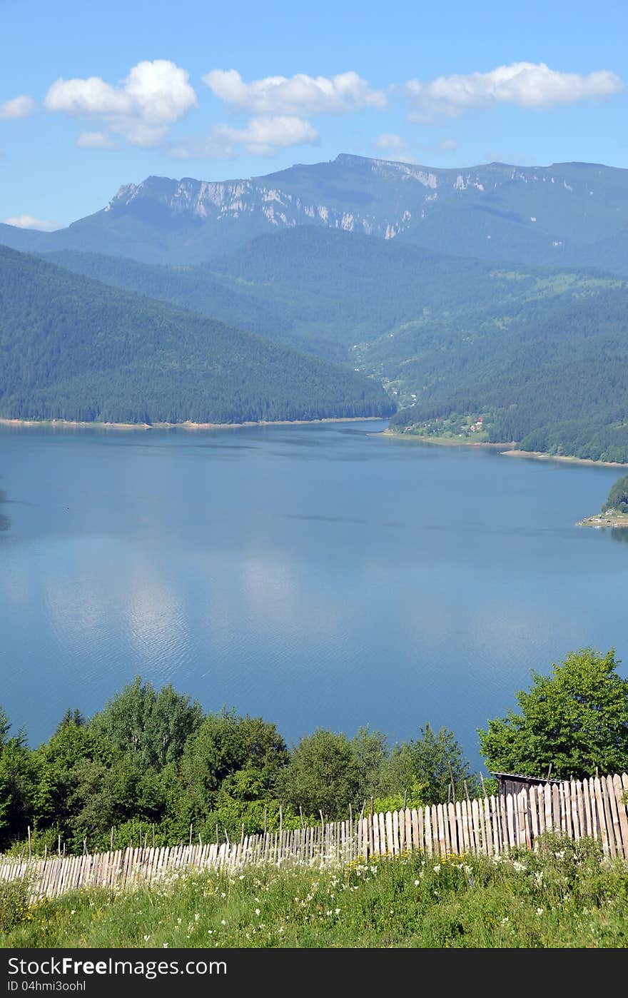 Curved bicaz lake in ceahlau mountains