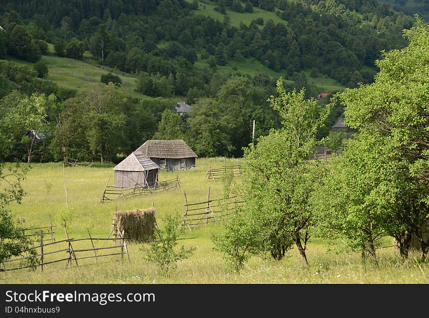 Wooden chalet on green hill and forest rural agriculture. Wooden chalet on green hill and forest rural agriculture