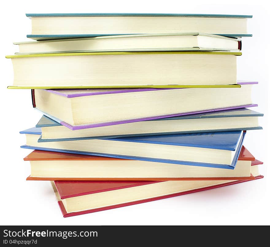 Pile of color hardcover books over white background. Pile of color hardcover books over white background