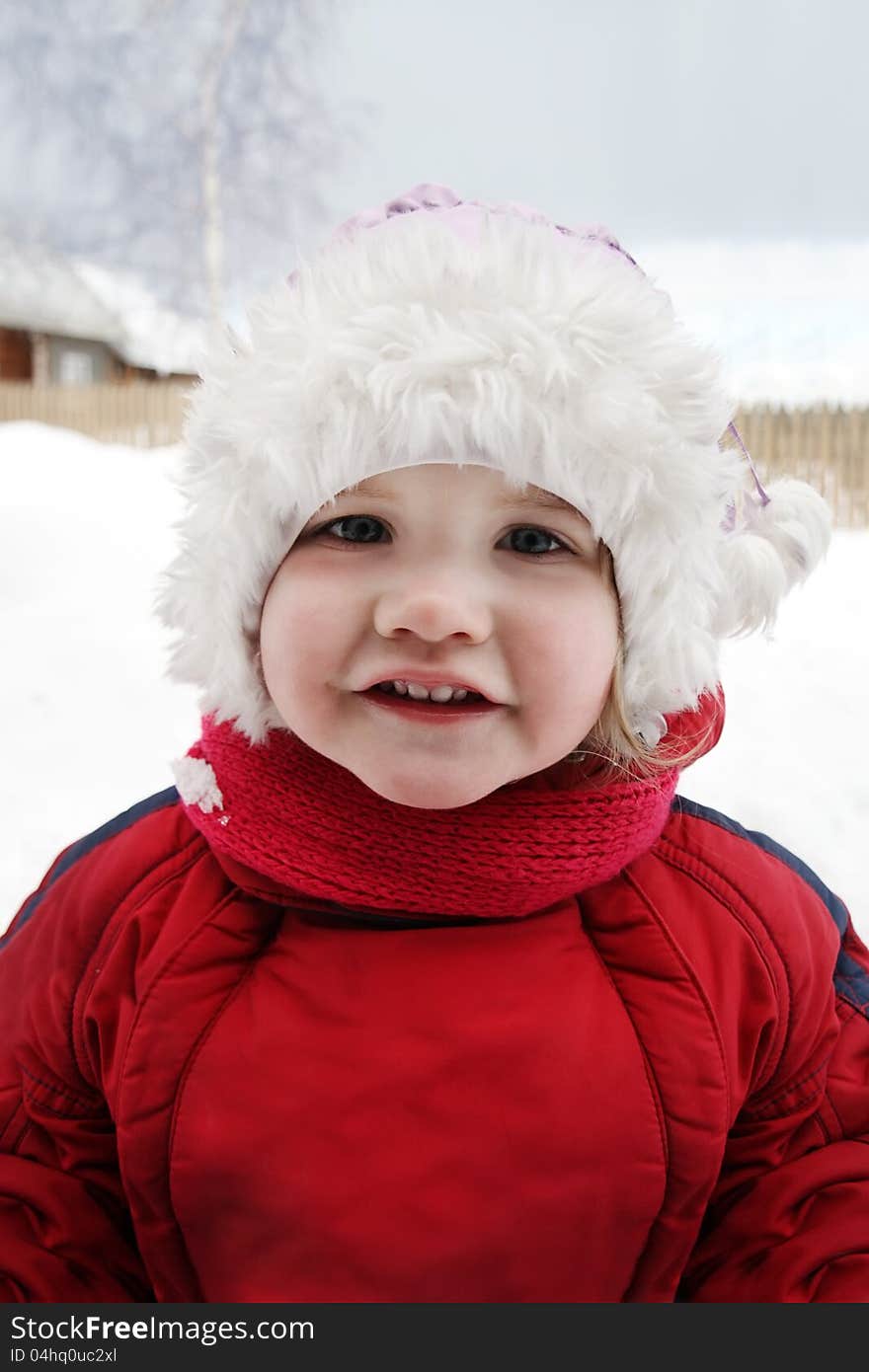 Cute Little Girl Stands Near Home And Smiles