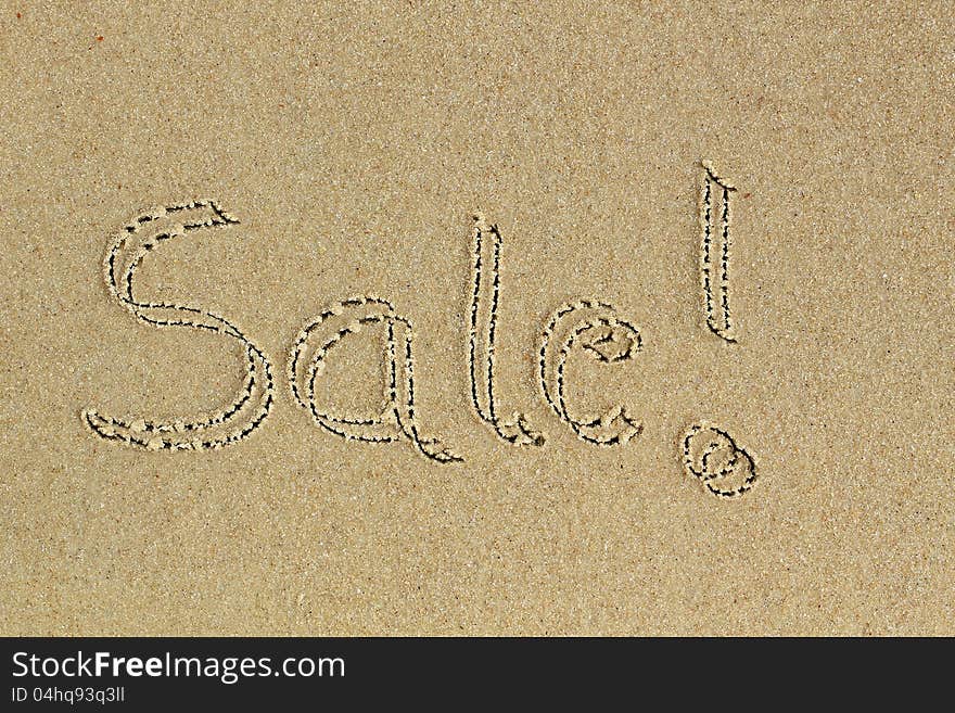 Sale word hand written with exclamation on sand in a beach - a communication message to consumers about discount available on shopping. Sale word hand written with exclamation on sand in a beach - a communication message to consumers about discount available on shopping