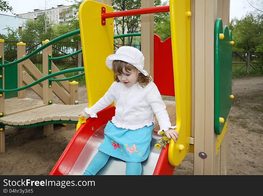 Cute Little Girl Prepares For Rolling At Slide