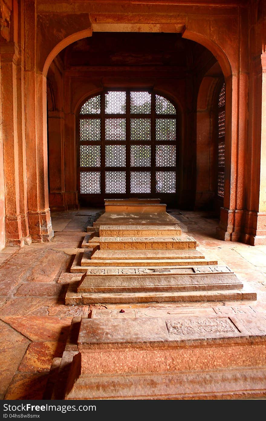 White marble tomb at Fatherpur Sikri, The ghost city, near Agra, Uttar Pradesh, Agra. Mogul architecture. Beautiful carving on pink sandstone. Islamic architecture style at King Akbar period. White marble tomb at Fatherpur Sikri, The ghost city, near Agra, Uttar Pradesh, Agra. Mogul architecture. Beautiful carving on pink sandstone. Islamic architecture style at King Akbar period.