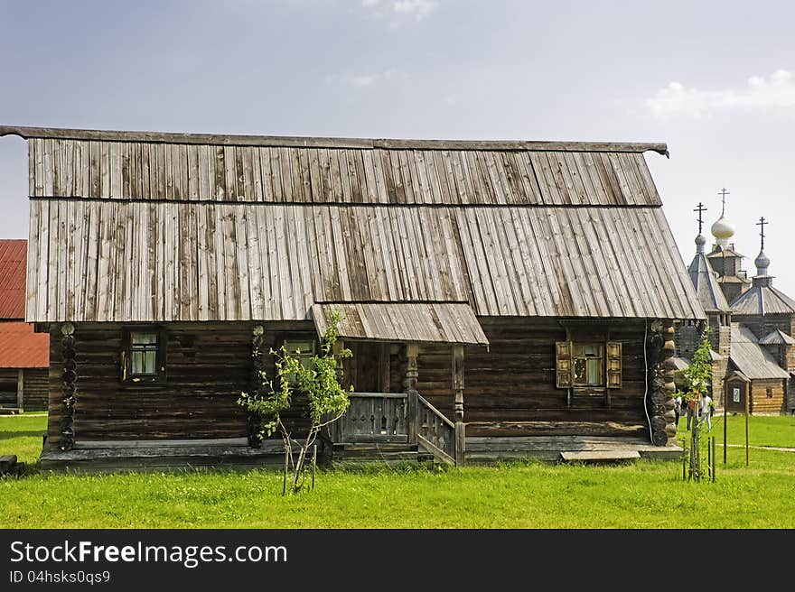 A one-storey wooden house with a porch. Russia.