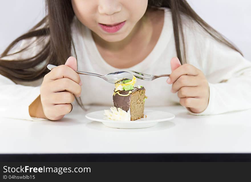 Girl eating cake. on white background