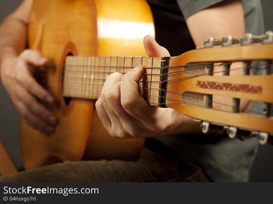 Close up of hands playing on guitar. Close up of hands playing on guitar