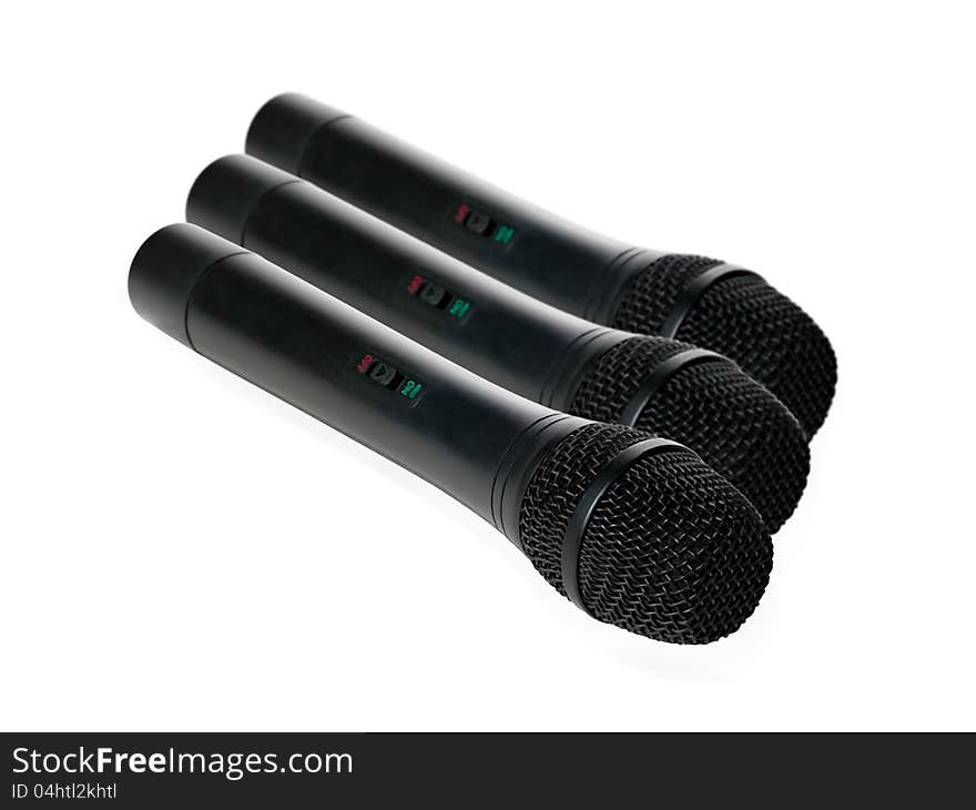 Black microphones on a white background. Black microphones on a white background