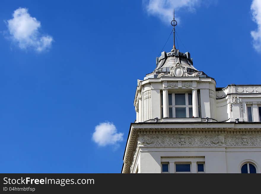 A typical building in Budapest touching the blue sky. A typical building in Budapest touching the blue sky