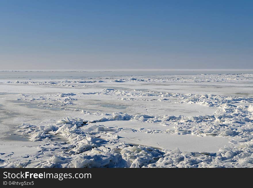 Frozen lake with crushed ice sheet