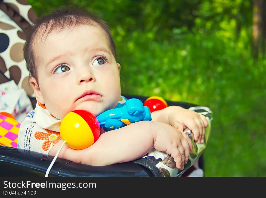 A child looks up in the park. A child looks up in the park