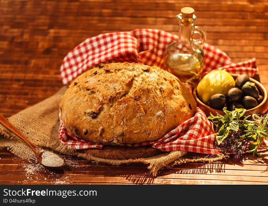 Loaf of traditionally baked rustic bread with provence herbs