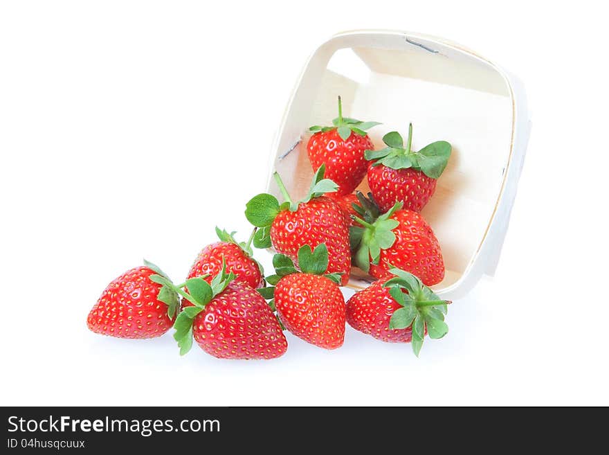 Sprinkled red strawberry from the basket. On a white background. Sprinkled red strawberry from the basket. On a white background.